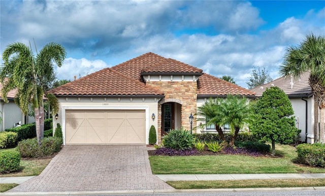 mediterranean / spanish-style house with a garage