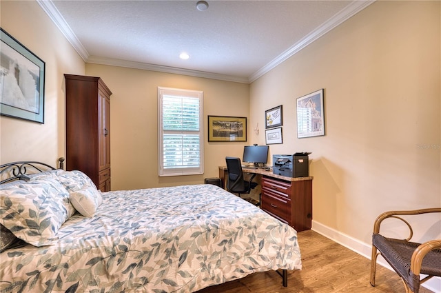 bedroom featuring light hardwood / wood-style flooring and ornamental molding