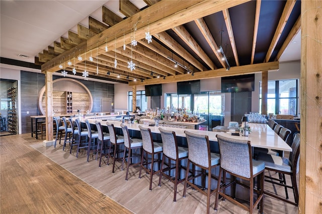 dining space with wood-type flooring