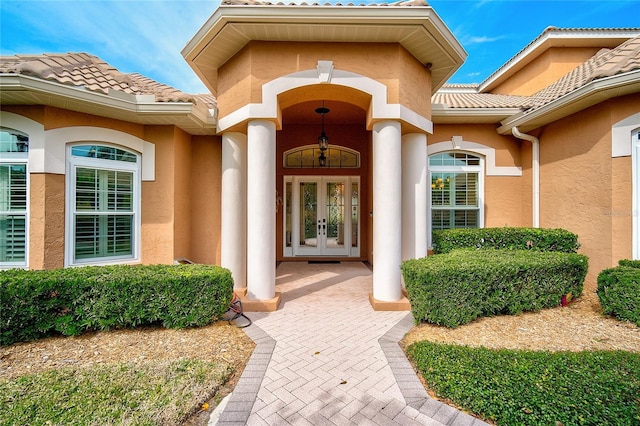 property entrance featuring french doors