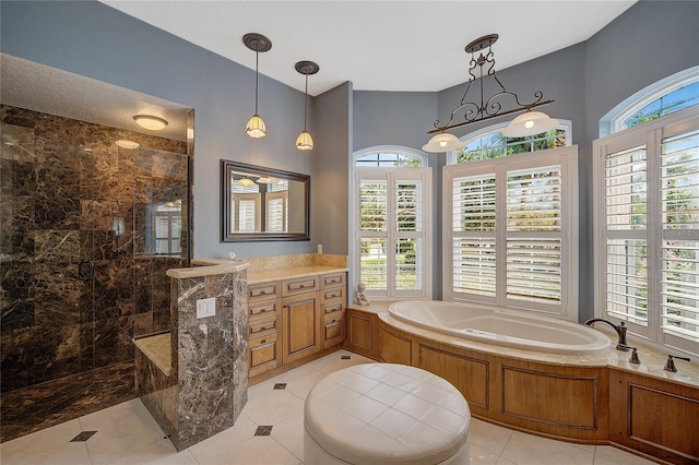 bathroom featuring tile patterned flooring, vanity, and independent shower and bath