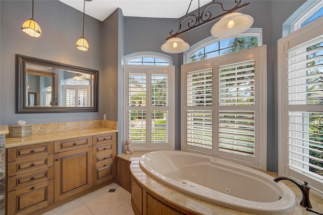 bathroom featuring tile patterned floors, plenty of natural light, and a relaxing tiled tub