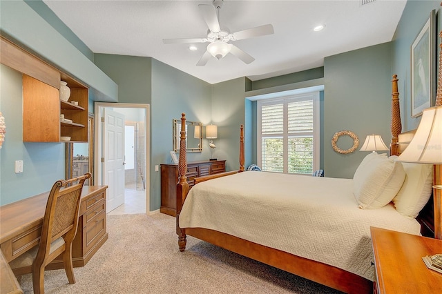 carpeted bedroom featuring ceiling fan and ensuite bathroom