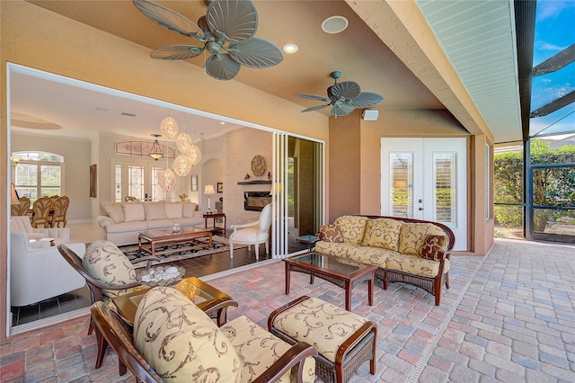 sunroom with a chandelier and french doors