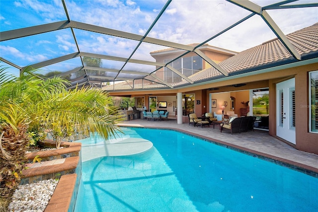 view of swimming pool with a patio area, an outdoor living space, ceiling fan, and glass enclosure