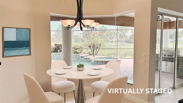 2123 Calusa Lakes Blvd, Nokomis, FL 34275 - dining area with a chandelier, tile patterned floors, and baseboards