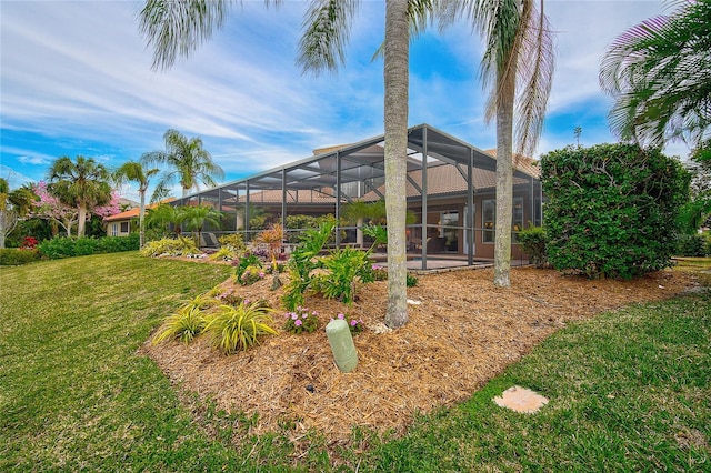 2123 Calusa Lakes Blvd, Nokomis, FL 34275 - view of grassy yard with glass enclosure and a patio
