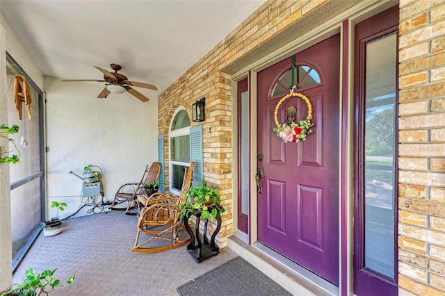 property entrance with ceiling fan and covered porch