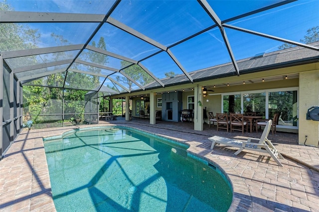 view of swimming pool featuring a lanai, a patio area, ceiling fan, and area for grilling