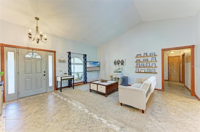 tiled living room with high vaulted ceiling and a notable chandelier