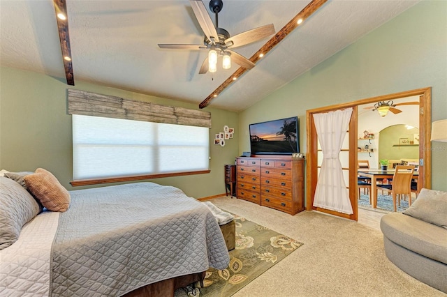 bedroom featuring carpet, french doors, a textured ceiling, ceiling fan, and vaulted ceiling with beams