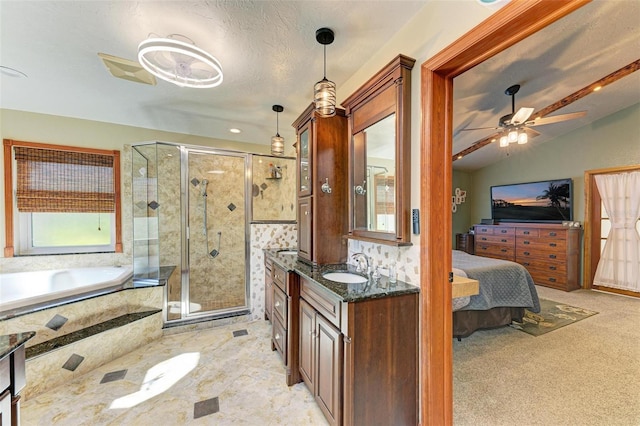 bathroom with ceiling fan, vanity, independent shower and bath, and vaulted ceiling