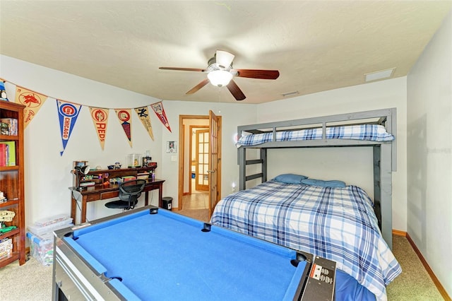 bedroom with carpet, ceiling fan, a textured ceiling, and billiards