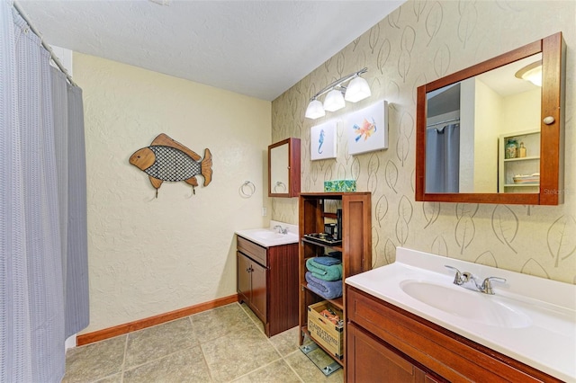 bathroom featuring vanity and a textured ceiling