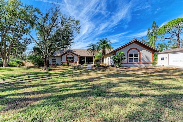 ranch-style house featuring a front yard