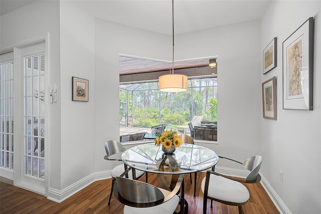 dining room with dark wood-type flooring