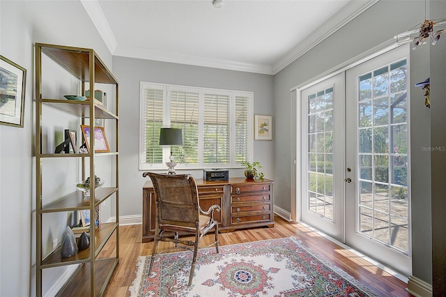 home office with french doors, light wood-type flooring, and ornamental molding