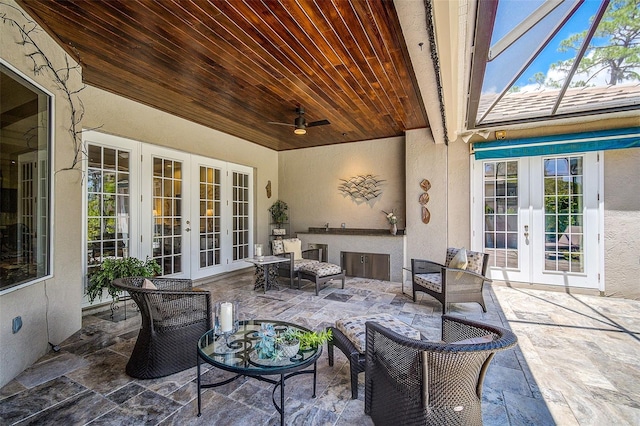 view of patio featuring ceiling fan and french doors