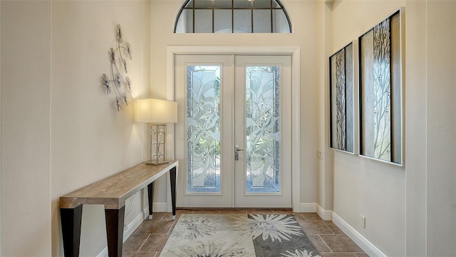 doorway to outside featuring french doors and a healthy amount of sunlight