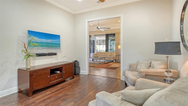 living room with dark hardwood / wood-style floors, ceiling fan, and ornamental molding