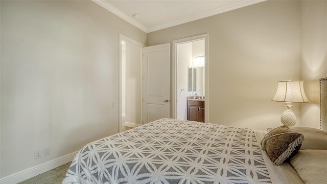 bedroom with carpet, crown molding, and ensuite bath