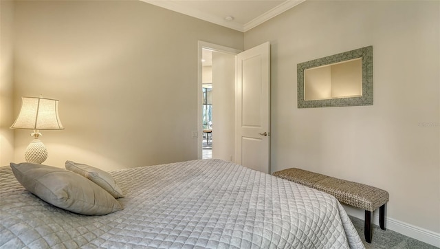 carpeted bedroom with ornamental molding