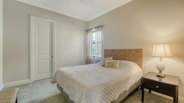 bedroom with ceiling fan, crown molding, and light carpet