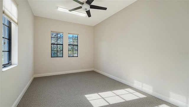 unfurnished room with carpet, plenty of natural light, and ceiling fan