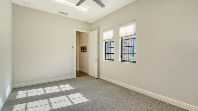 empty room with light carpet and ceiling fan