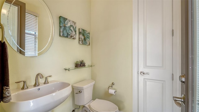 bathroom with toilet and sink