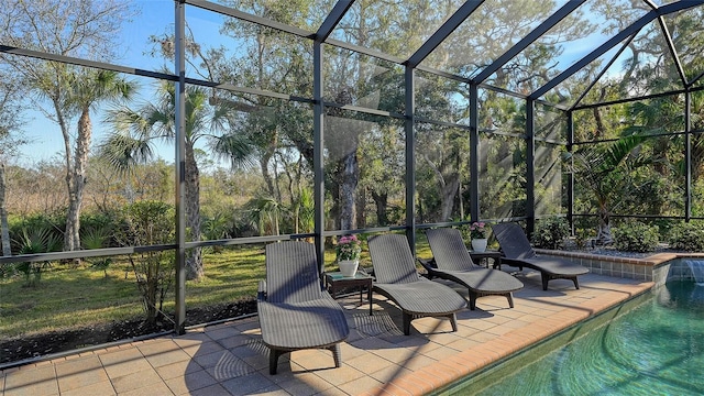 view of patio featuring a lanai