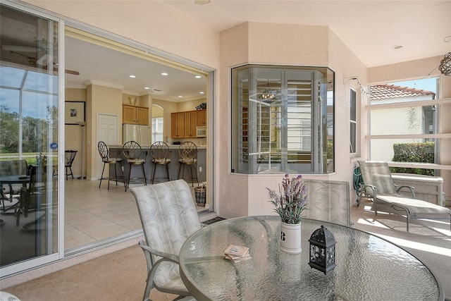 dining area featuring recessed lighting, light tile patterned flooring, and crown molding