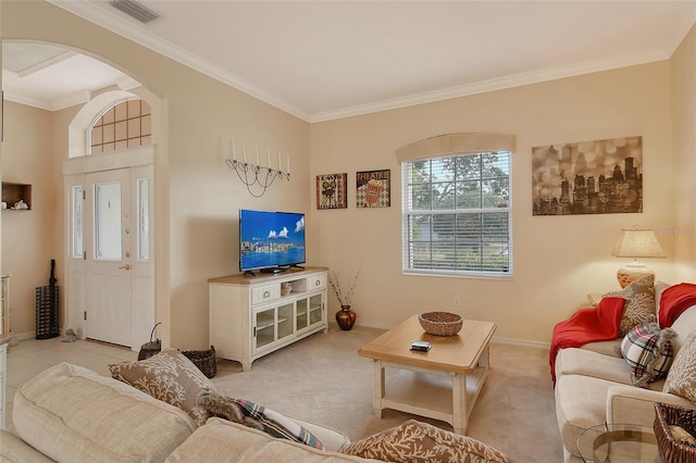 living area featuring arched walkways, crown molding, light colored carpet, visible vents, and baseboards