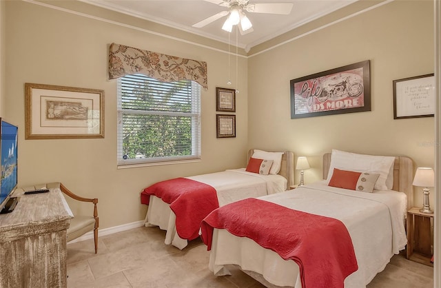 bedroom with a ceiling fan, baseboards, and crown molding