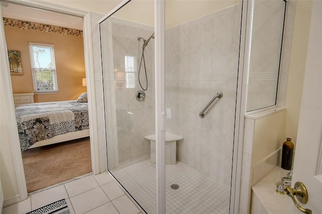 full bathroom with a stall shower, ensuite bath, and tile patterned floors