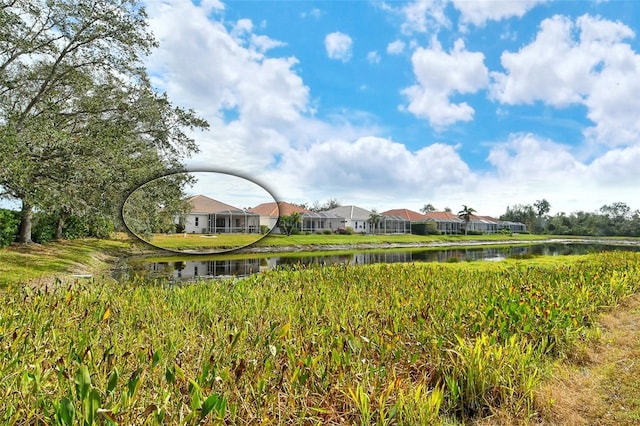 view of home's community with a residential view and a water view