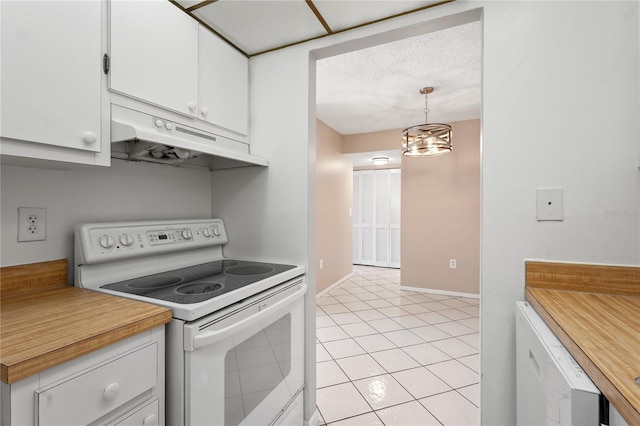 kitchen featuring white appliances, light tile patterned floors, decorative light fixtures, white cabinets, and a chandelier