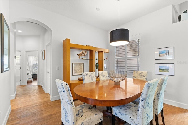 dining space with light wood-type flooring