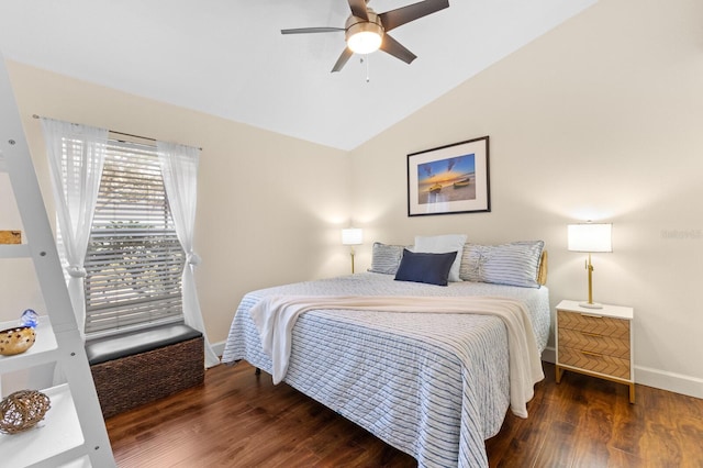 bedroom with ceiling fan, dark hardwood / wood-style floors, and vaulted ceiling