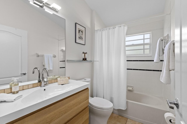 full bathroom featuring tile patterned flooring, vanity, toilet, and shower / tub combo