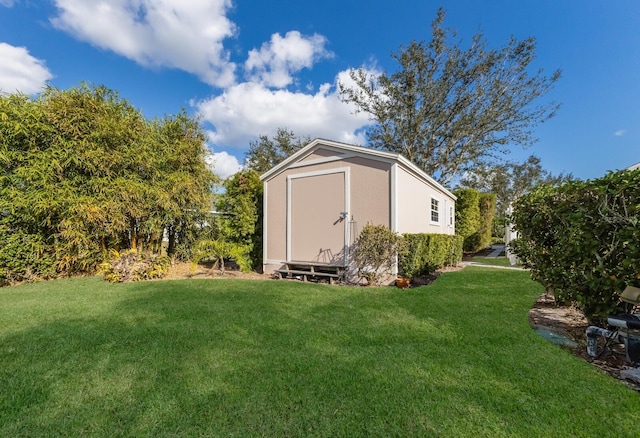 view of outbuilding with a yard