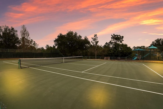 view of sport court with a playground