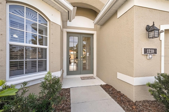 entrance to property featuring french doors