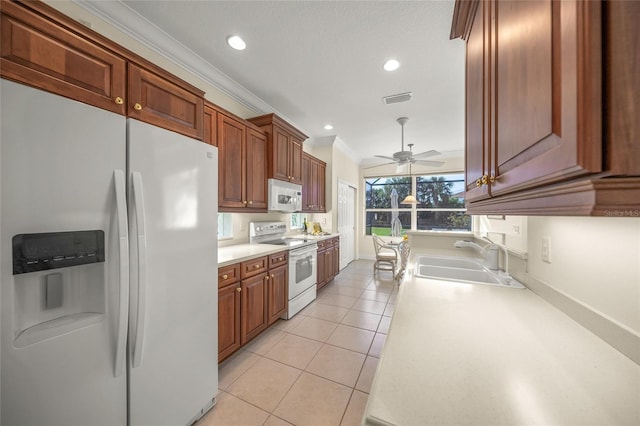 kitchen with white appliances, ceiling fan, crown molding, sink, and light tile patterned flooring