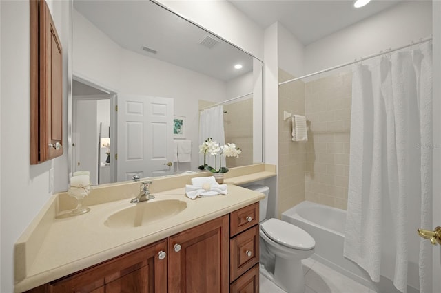 full bathroom with tile patterned flooring, shower / tub combo with curtain, vanity, and toilet