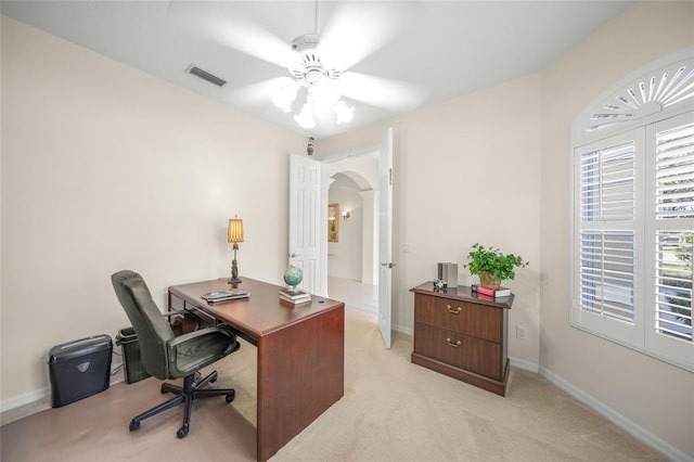 office with ceiling fan and light colored carpet