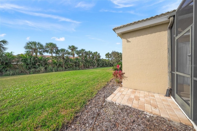 view of yard featuring a lanai