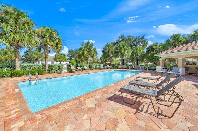 view of swimming pool featuring a patio