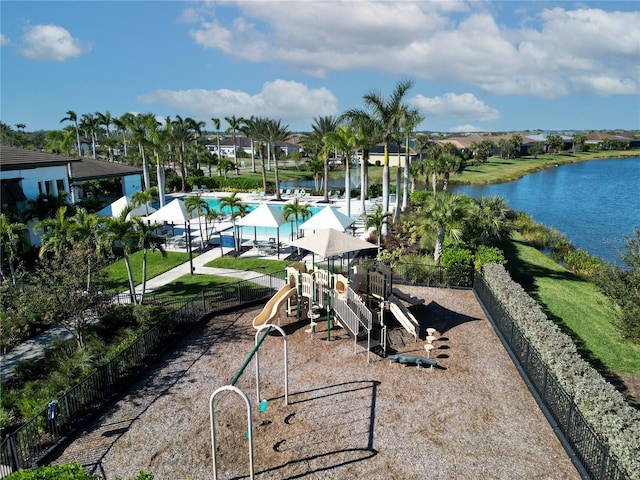 exterior space featuring a community pool and a water view