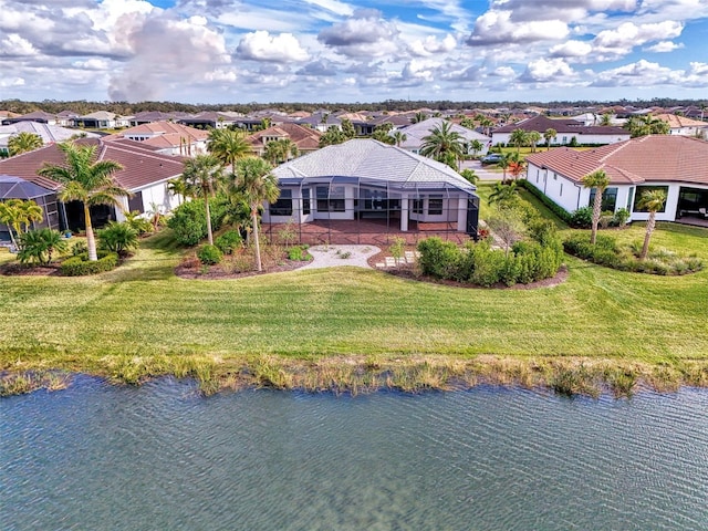 drone / aerial view featuring a residential view and a water view